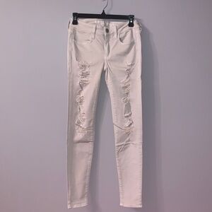 American eagle light pink beige khaki color super stretch size 2 ripped jeans
